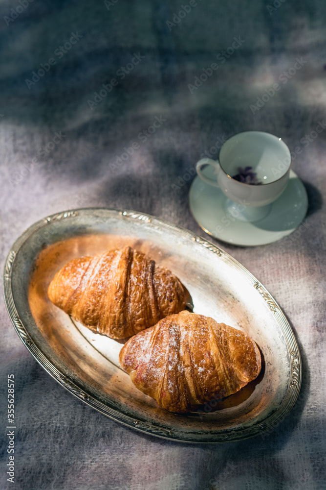 croissant and cup of coffee, top view