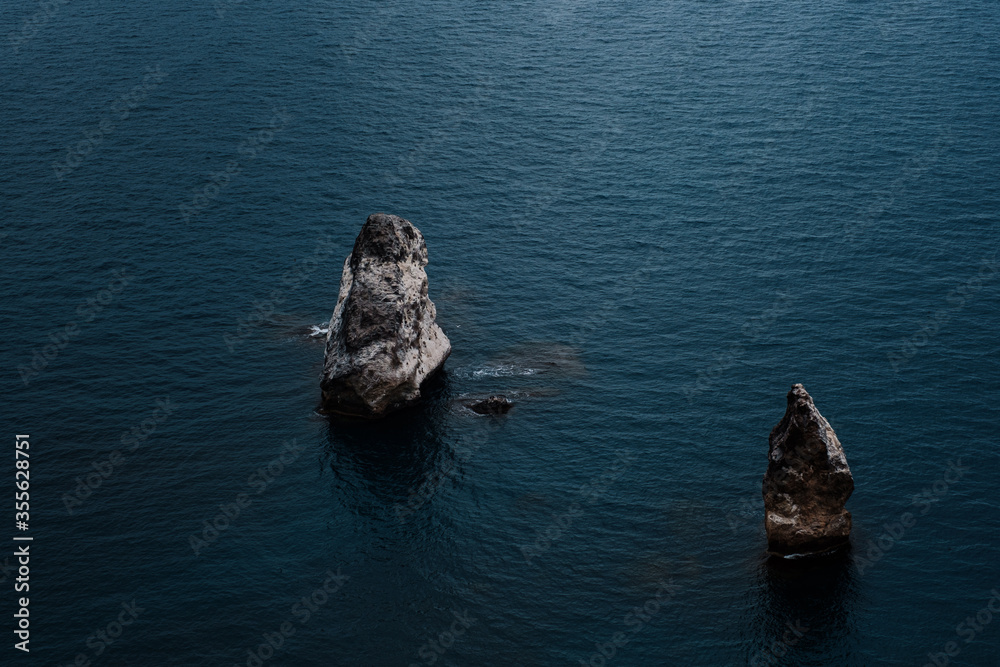 Fototapeta premium Picturesque seascape with rocky cliffs, stones, sea bay