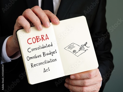 Photos Business concept meaning COBRA Consolidated Omnibus Budget Reconciliation Act with phrase on the page
