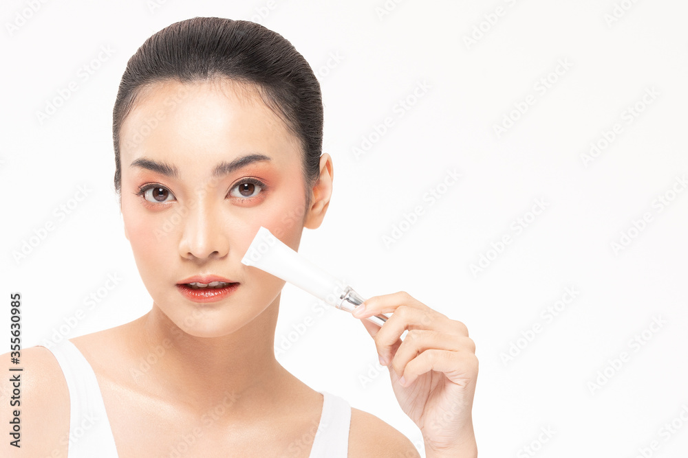 Beauty asian woman hold bottle cosmetic cream lotion and cheerful. Beauty asian woman hold bottle cosmetic cream lotion and cheerful.