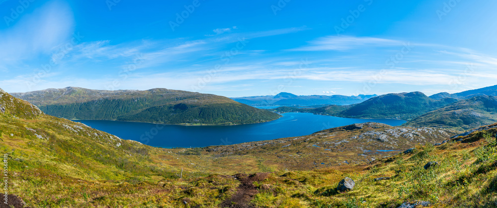 Panoramic view of fjord Kakdfjorden and surrounding mountains on the west coast of the island of Kvaloya in Tromso Municipality in Troms county, Norway