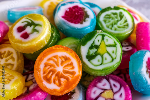 Colorful candy sweets close up, selective focus. Different tastes and drawings of fruits on candies, selective focus