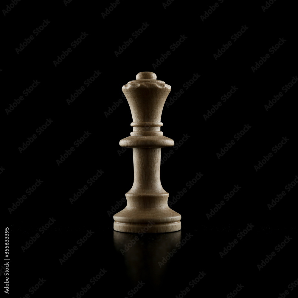 white chess piece on a black background white chess piece on a black background