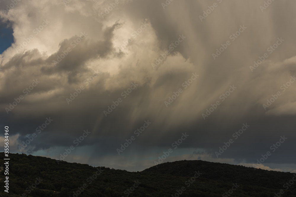 drawn rain clouds with wind and clouds