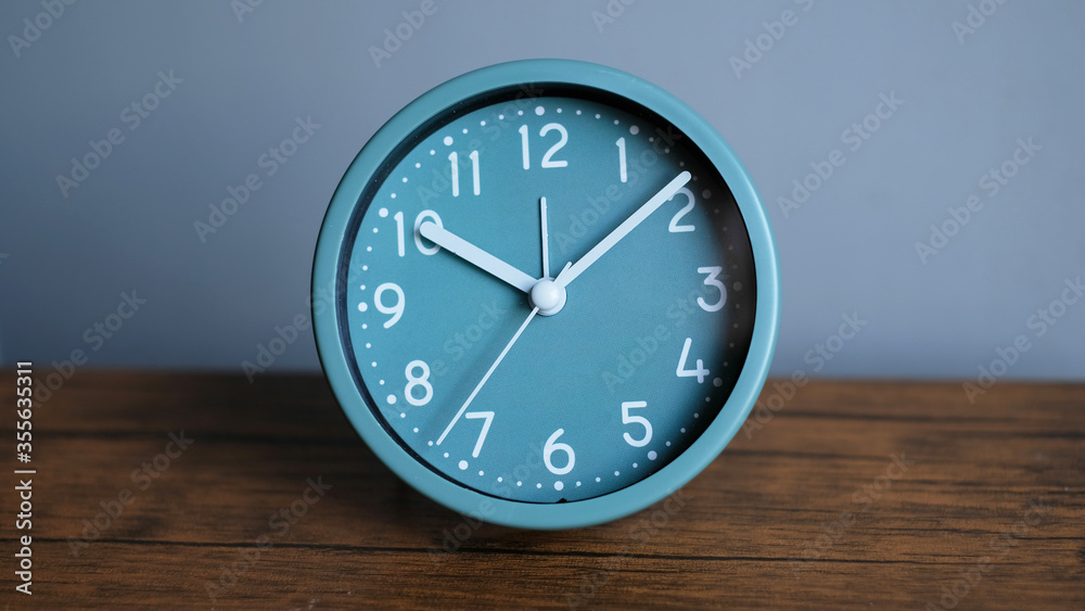 Close-up alarm clock on table, business concept. Close-up alarm clock on table, business concept.