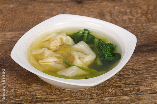 Asian traditional Wonton soup with herbs