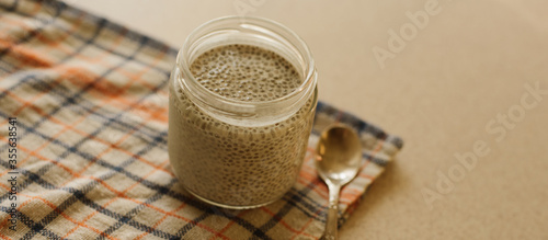 Dessert bowl of tasty chia seed pudding on white background