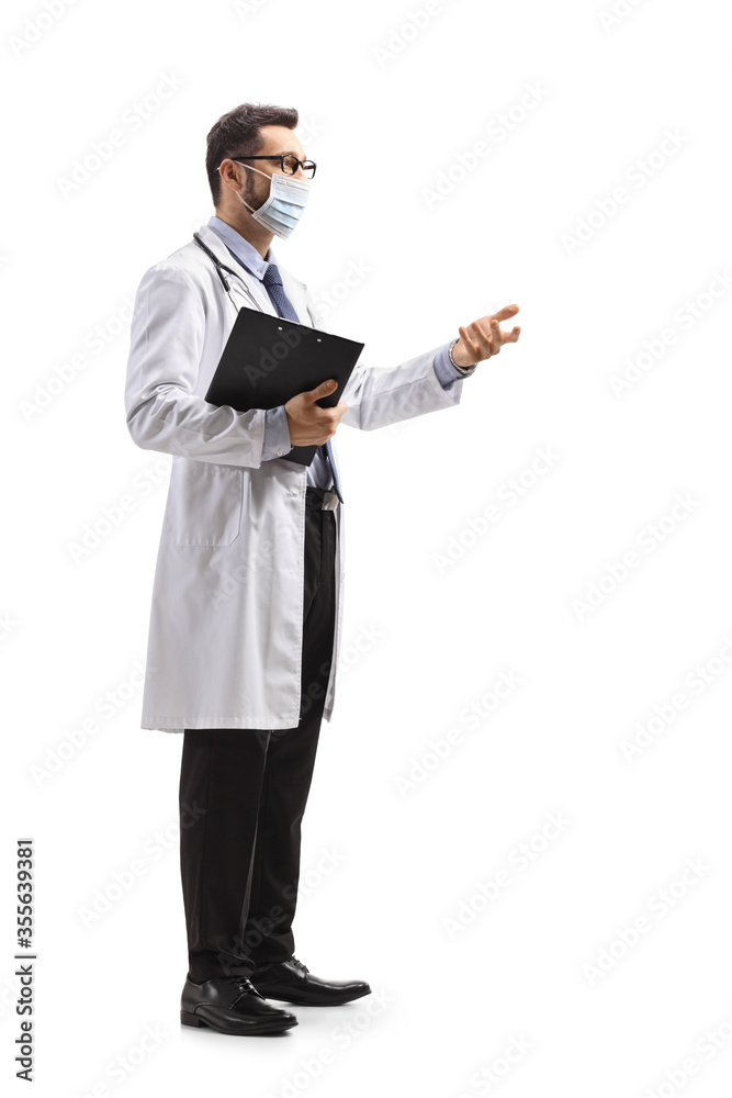 Male doctor with a protective face mask gesturing with hand