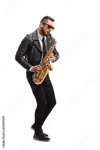 Man in a leather jacket playing a saxophone