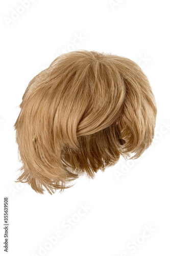 Subject shot of a natural looking blonde wig with bangs. The short wig is isolated on the white background. 