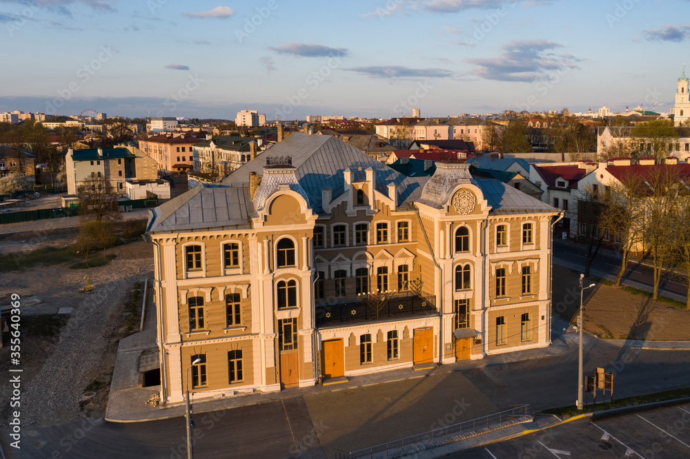 Beautiful eclectic synagogue in the city center in the evening, aerial photography