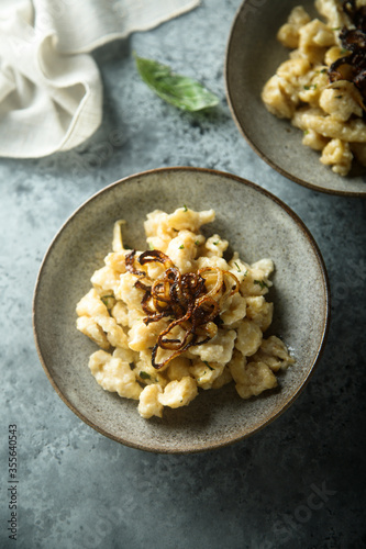 Traditional German noodles with cheese and fried onion