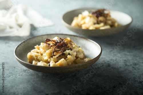 Traditional German noodles with cheese and fried onion