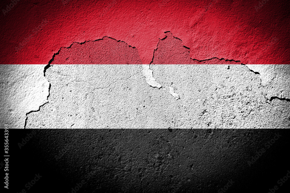 Yemen flag on cracked wall