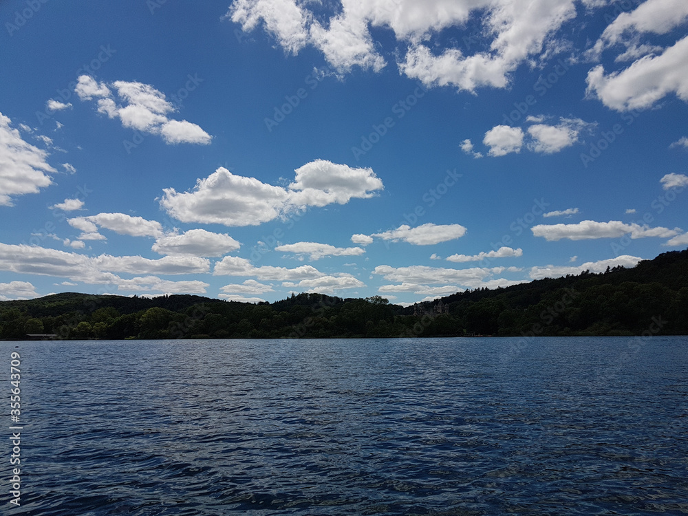 Lake Laacher See Mendig Germany June 2019 in the afternoon beautiful weather with blue sky and interesting clouds