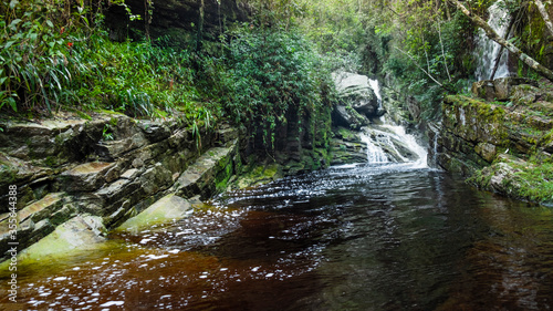 Fototapeta Naklejka Na Ścianę i Meble -  A waterfall in lush rainforest