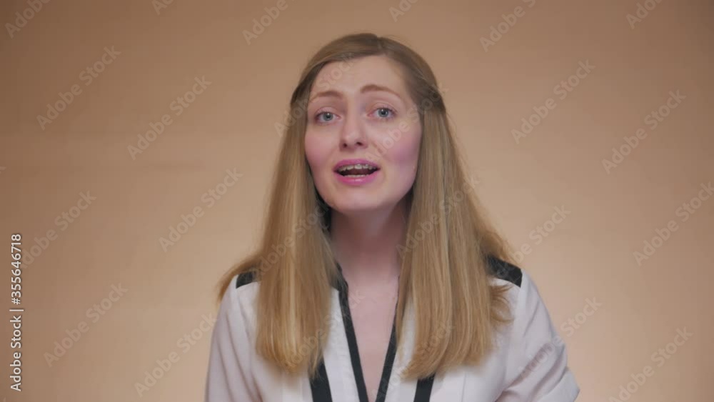 The girl sings badly front portrait learning to sing young woman with braces caucasian white 30 years old failed bad take The girl sings badly front portrait learning to sing young woman with braces caucasian white 30 years old failed bad take