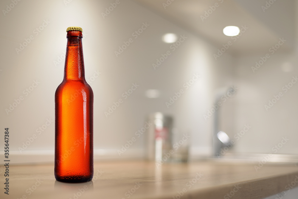 Brown beer bottle on kitchen table. Mock-up design presentation. Brown beer bottle on kitchen table. Mock-up design presentation.