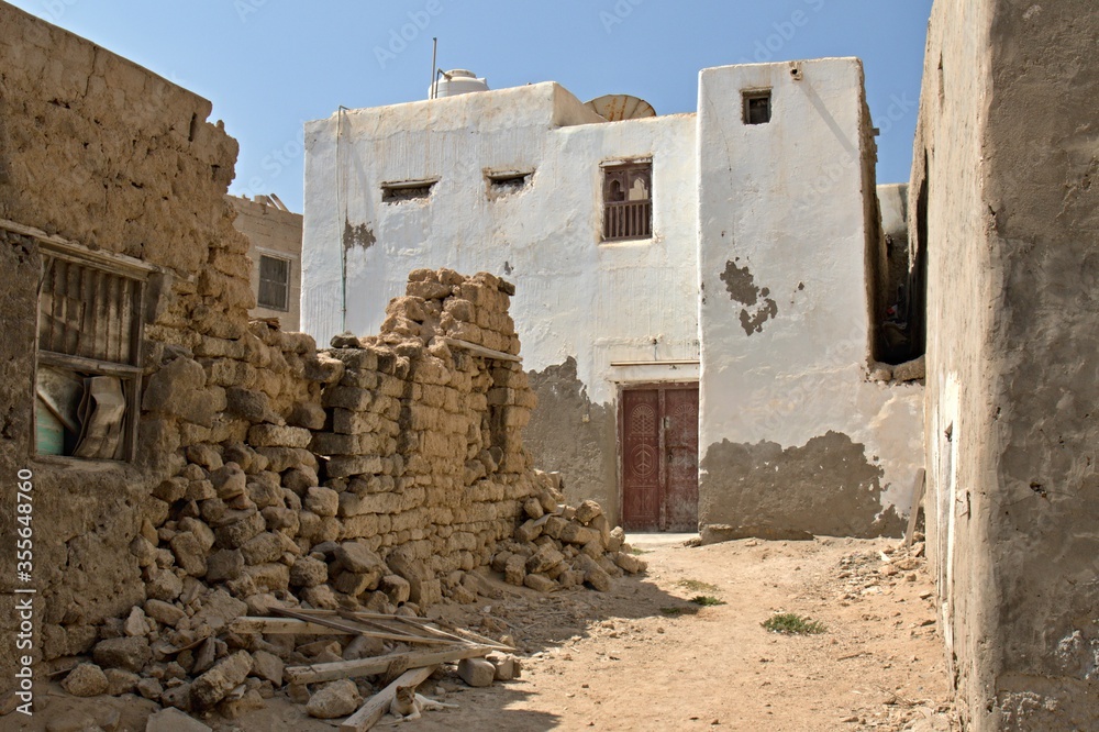Ruins of old houses on the streets of Mirbat city. Oman. Asia.