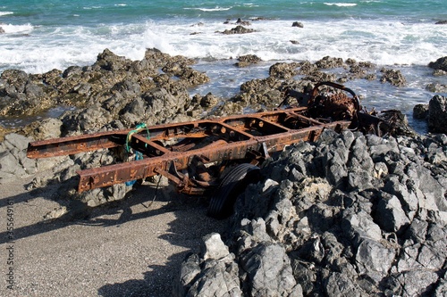 Beautiful and deserted beaches, stunning Arabian Sea waters, super sea swimming can be enjoyed on the Masirah Island of Oman. Someone on the beach has put down the rest of the car. Oman .Asia photo