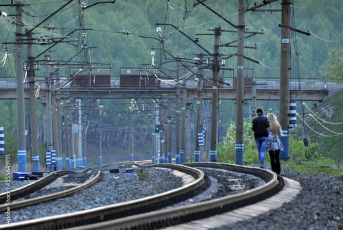 Travelers walking on the rails of the Trans-Siberian Railway