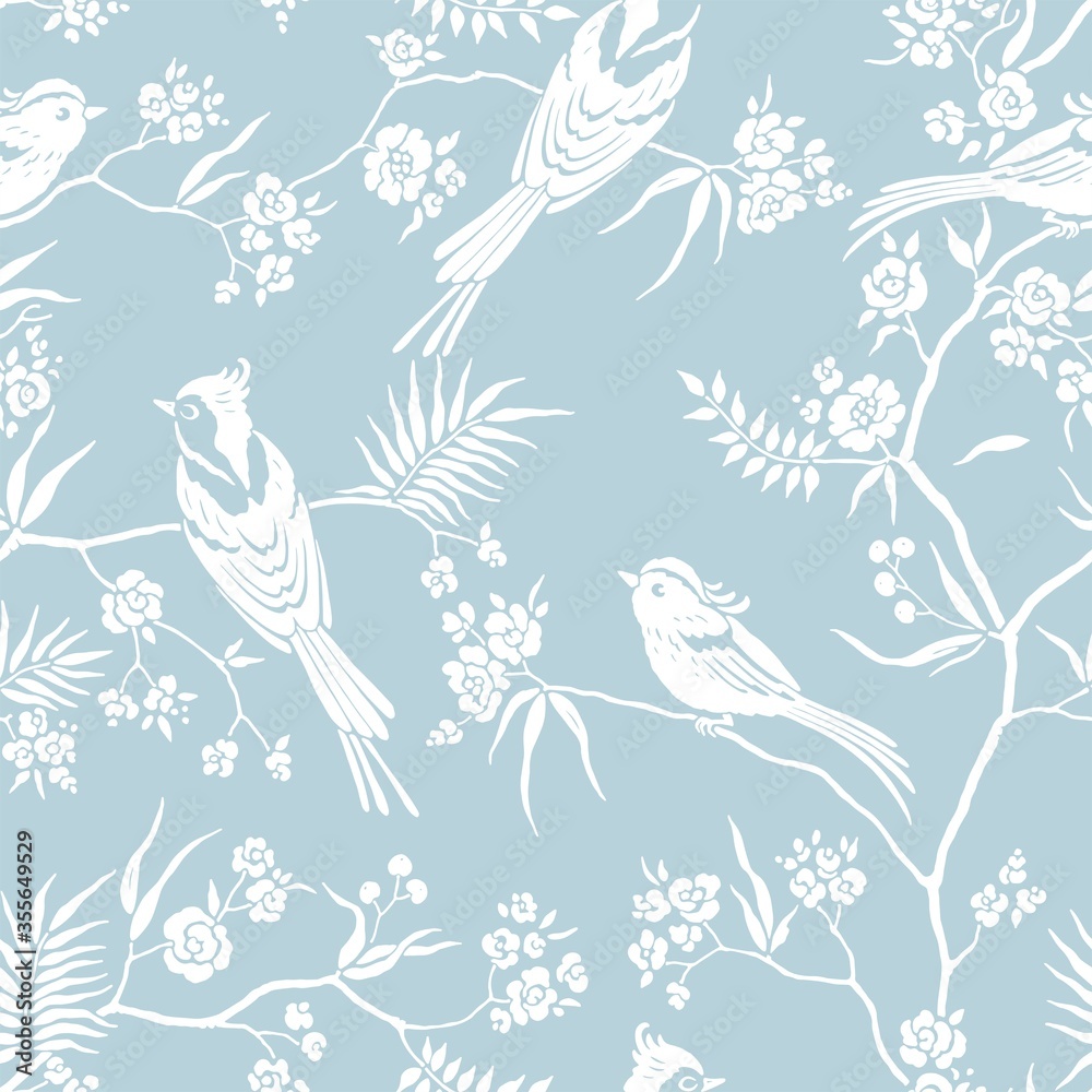 Seamless pattern in oriental style with blooming branches trees and birds. Wildlife silhouette, white floral ornament on blue background. Vector hand drawn illustration, garden in japanese style.