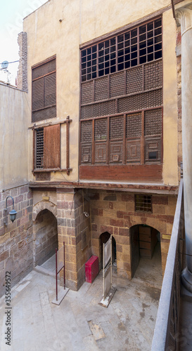 Facade of ottoman era historic Waseela Hanem House with wooden oriel windows - Mashrabiya - Medieval Cairo, Egypt photo
