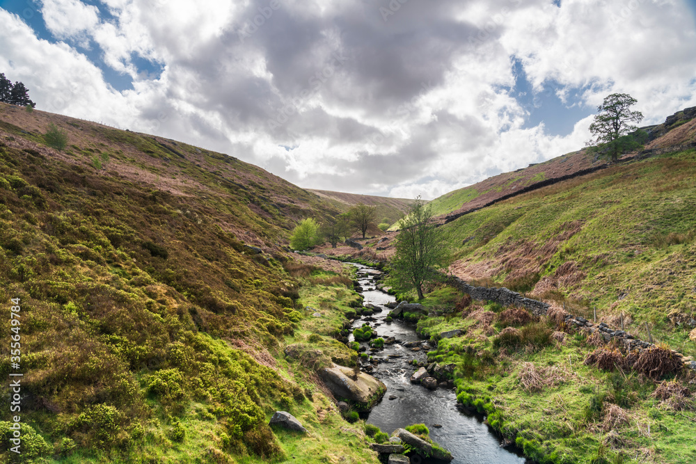 Naklejka premium A summer three image HDR picture of Graining Water, which flows down Hardcastle Crags to Hebden Bridge in West Yorkshire.
