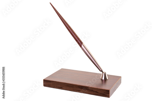 Fountain pen on wooden stand isolated on white. Desk set fountain ink pen