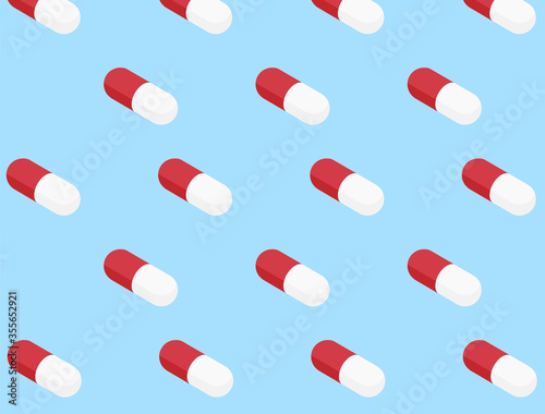 Capsule pills pattern on a blue background. Vector