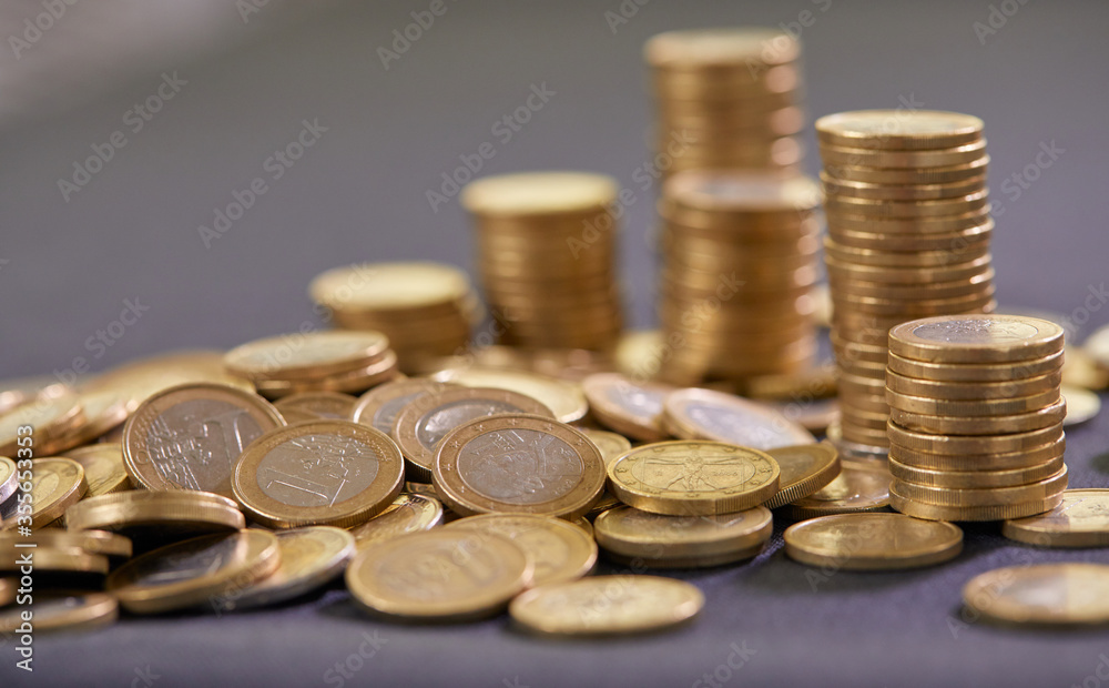 Stock Photo - Euro coins. Euro money. Euro currency.Coins stacked on each other in different positions. Money concept Stock Photo - Euro coins. Euro money. Euro currency.Coins stacked on each other in different positions. Money concept