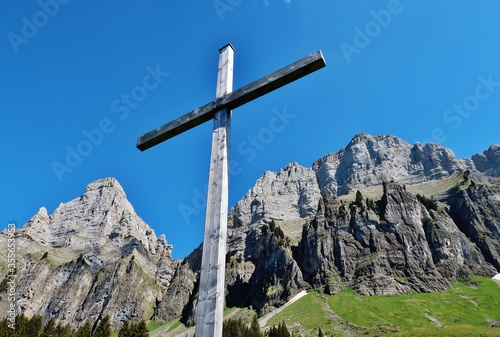 Bergkreuz vor der Südwand der Churfirsten, Ostschweiz photo