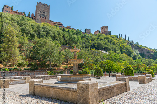 Alhambra palace viewed from Paseo de los Tristes in Granada, Spain