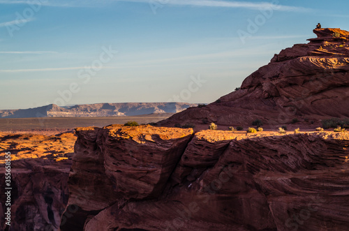 Grand canyon sunrise with man on the rock