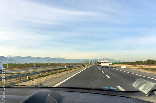 View from inside the car of the highway on the countryside of Chile
