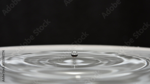 Ripples created by water drops, in the bowl.