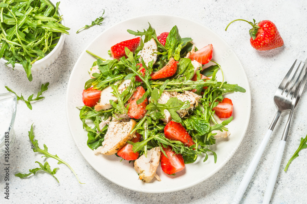 Green salad with chicken, strawberry and arugula. Green salad with chicken, strawberry and arugula.