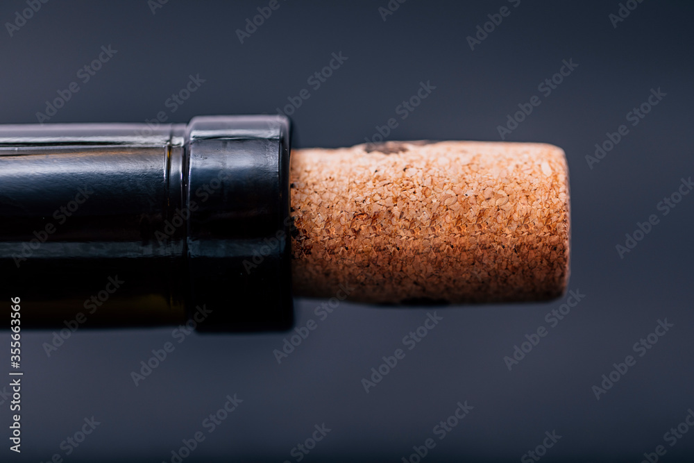 Cork in a bottle of wine close up with copy space for text. Template for greetings.