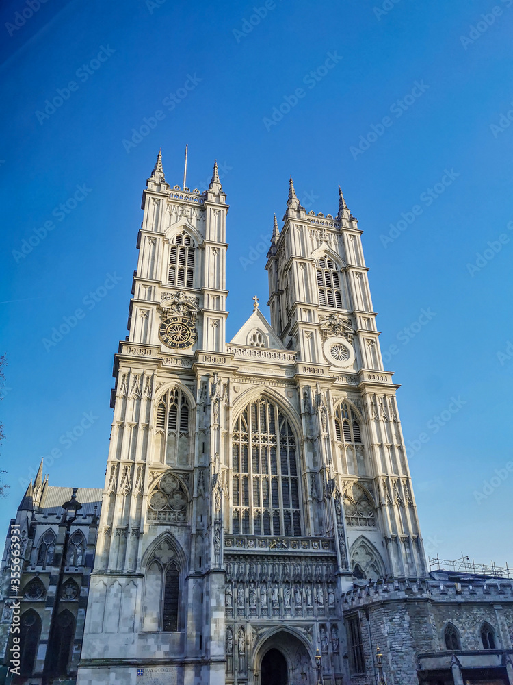 Westminster Abbey Church against bright blue sky during sunset. Royal wedding was held here in United Kingdom, England, London, Westminster.