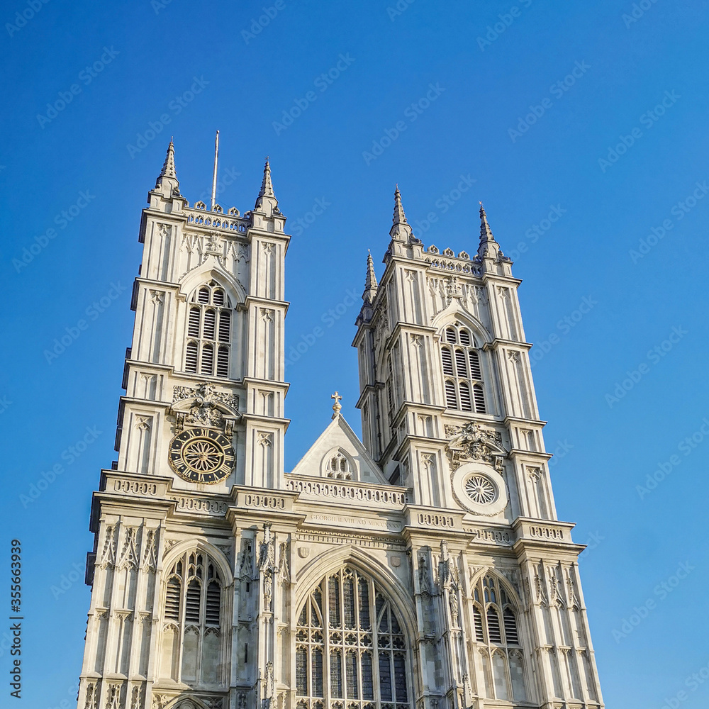 Westminster Abbey Church against bright blue sky during sunset. Royal wedding was held here in United Kingdom, England, London, Westminster.