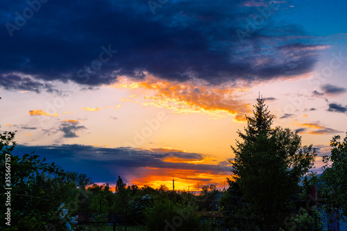  clouds and sunset over the village in spring