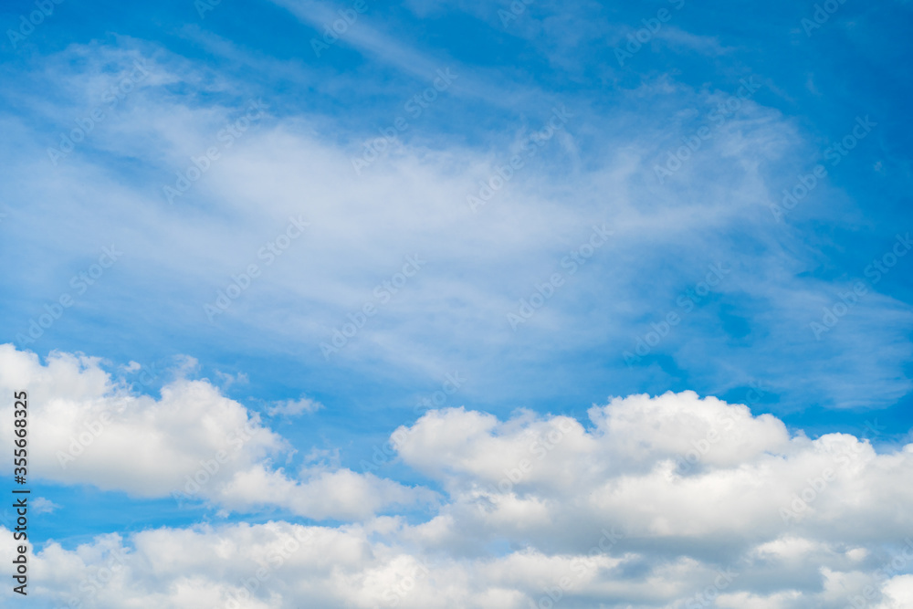 Blue sky and white clouds on day time for use background. Bright blue sky, white clouds and soft wind blowing in summer