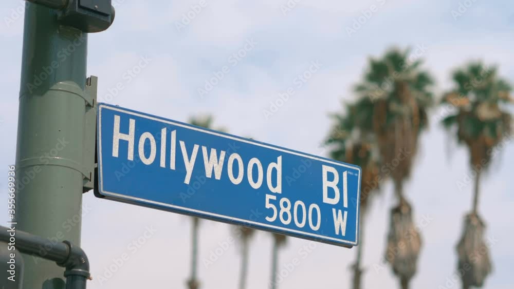 Hollywood boulevard street sign and traffic lights in 4k slow motion 60fps