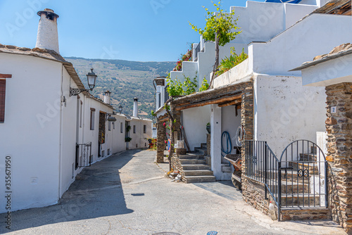 Typical white street of Capileira village in Spain photo