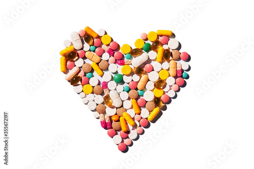 group of pills arranged in the shape of a heart, pills for the heart, heart disease concept