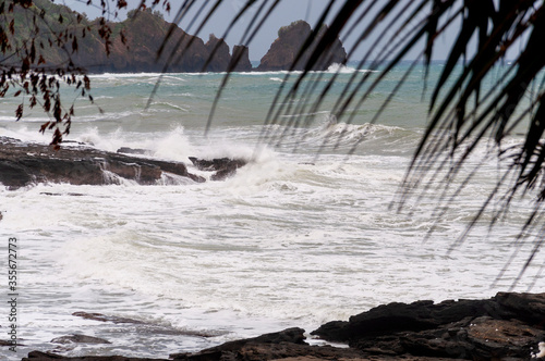 Waves from tropical storm Seniang - Jangmi pounding the coastline on Panay island in the Philippines photo