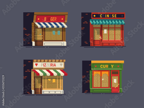 Set of boarded up shops, restaurants and cafes