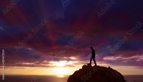 Man watching the sunset over the sea, Mount Jaizkibel, Euskadi