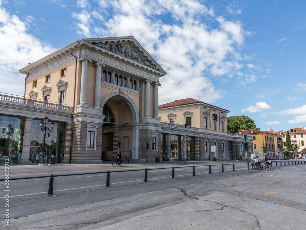 adua, entrance of new restorated Foro Boario parking at daytime with no cars in the street, near Prato della Valle square, with blue sky with some clouds