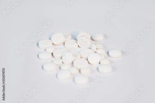 white pills isolated on white background